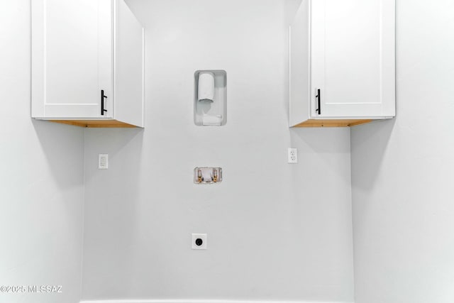 washroom with washer hookup, cabinet space, and hookup for an electric dryer