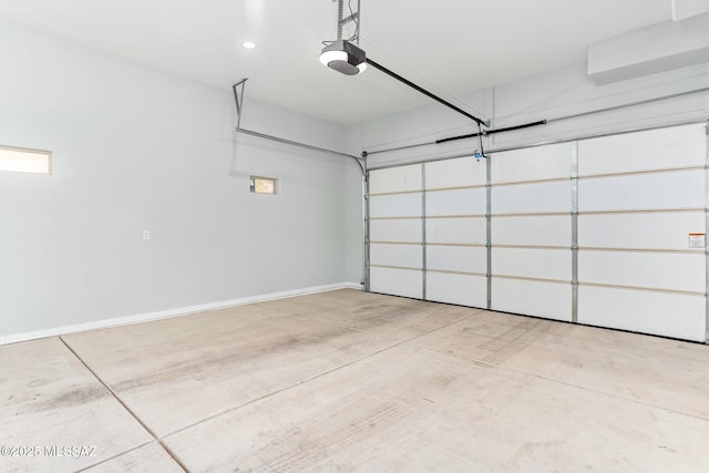 garage with recessed lighting, baseboards, and a garage door opener