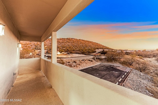 patio terrace at dusk with a balcony