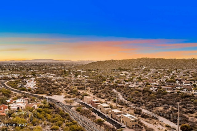 drone / aerial view featuring a residential view and a mountain view
