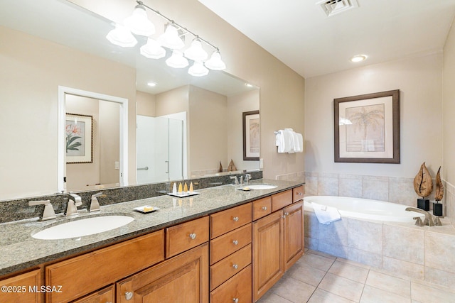 5775 S Camino Del Sol Unit 5203, Green Valley, AZ 85622 - bathroom with tile patterned flooring, vanity, and tiled bath