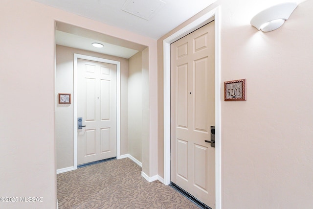 doorway with light colored carpet