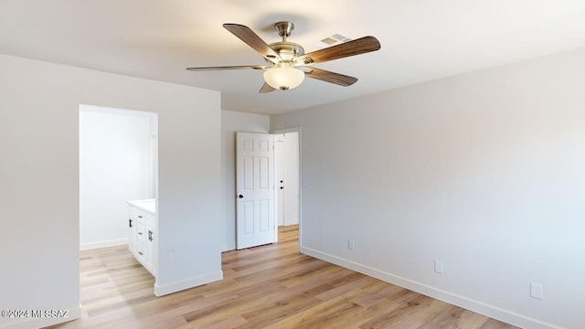 unfurnished bedroom featuring ceiling fan and light wood-type flooring