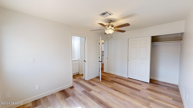 unfurnished bedroom featuring a closet, ceiling fan, and light wood-type flooring