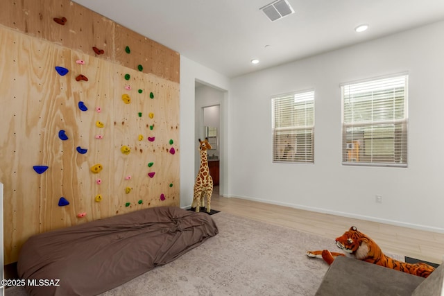 bedroom with wood-type flooring