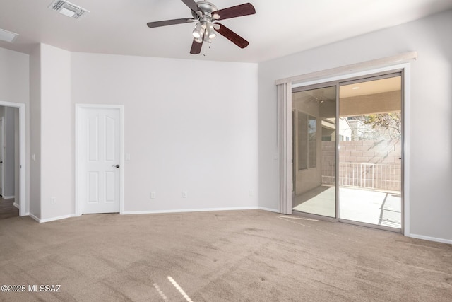 carpeted spare room with ceiling fan