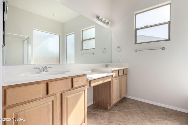 bathroom featuring a shower with door, vanity, and tile patterned flooring