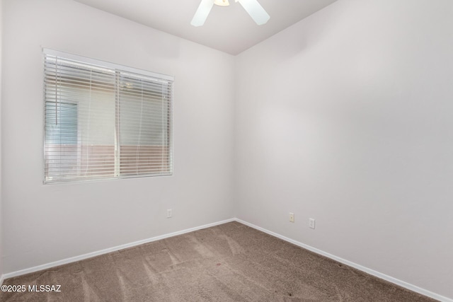 empty room with carpet and ceiling fan