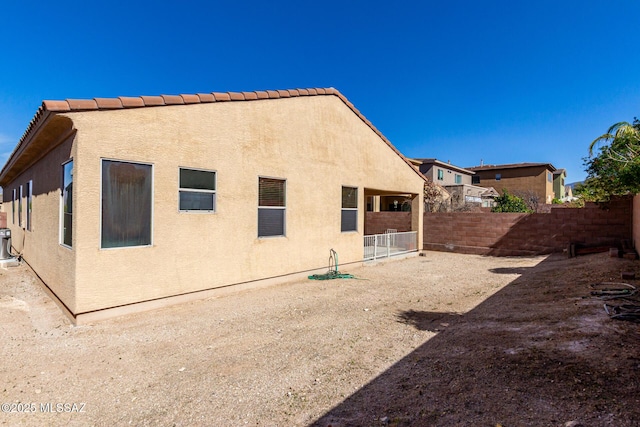 rear view of house with central AC