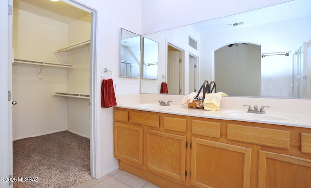 bathroom with vanity and tile patterned floors