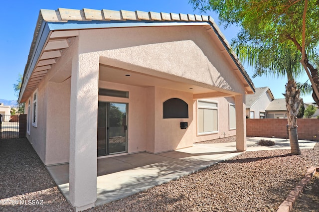 rear view of house with a patio