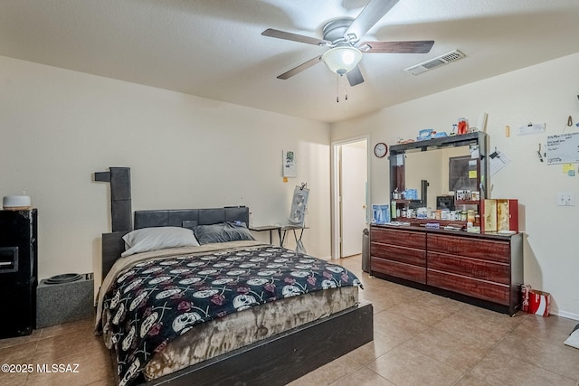 bedroom with light tile patterned floors