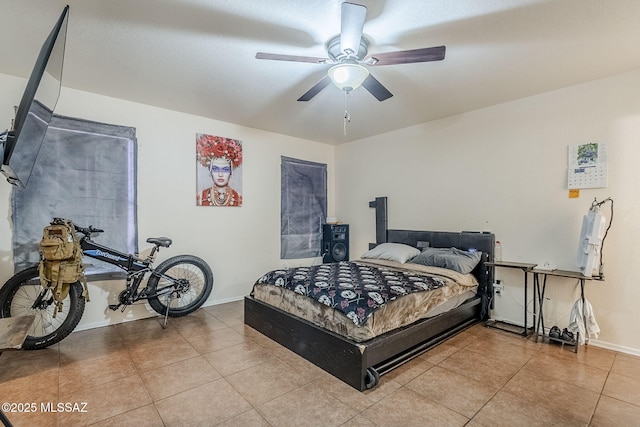 tiled bedroom with ceiling fan