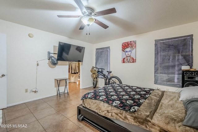 tiled bedroom with ceiling fan