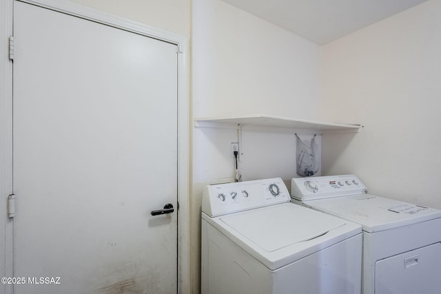 clothes washing area with washer and dryer