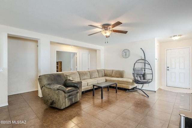 living room with tile patterned flooring and ceiling fan