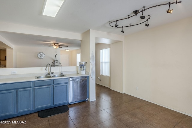 kitchen featuring blue cabinets, sink, dishwasher, dark tile patterned flooring, and ceiling fan