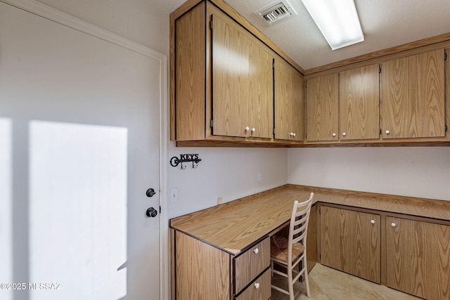 home office featuring built in desk