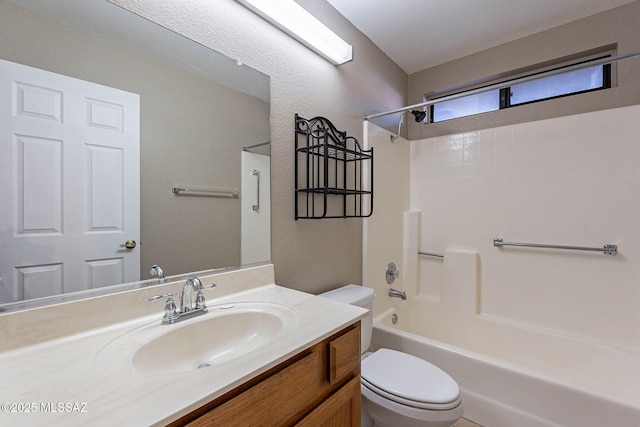 full bathroom featuring toilet, vanity, and shower / bathtub combination