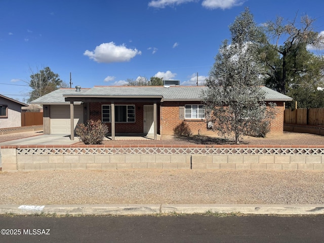 single story home featuring a garage