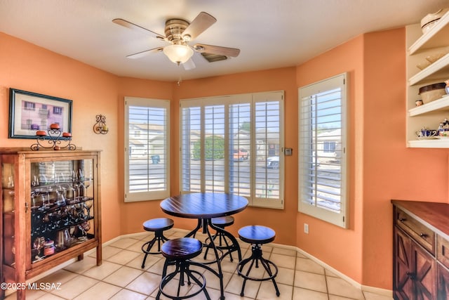 dining room featuring light tile patterned floors and ceiling fan