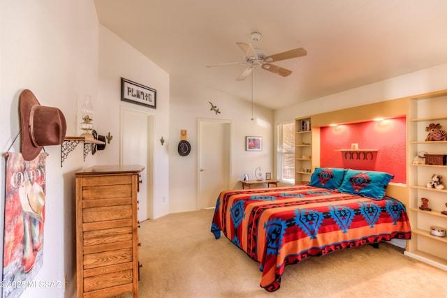 carpeted bedroom with vaulted ceiling and ceiling fan