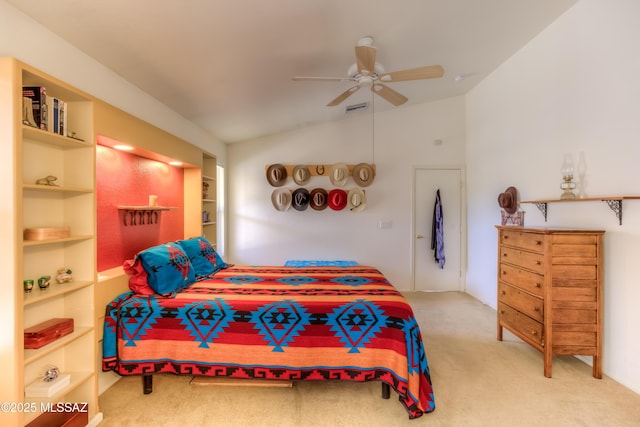 carpeted bedroom with vaulted ceiling and ceiling fan