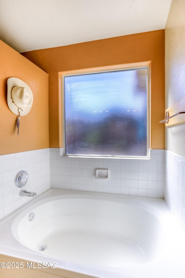 bathroom with a washtub