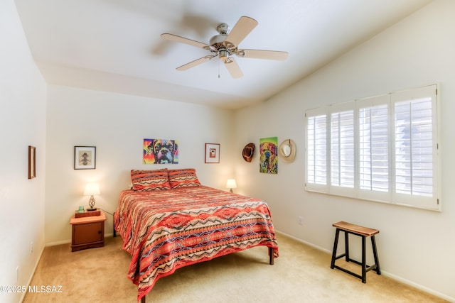 bedroom with light carpet, lofted ceiling, and ceiling fan