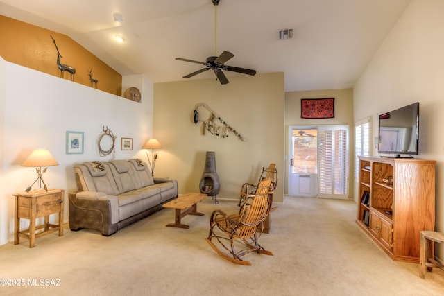 living room with lofted ceiling, light carpet, and ceiling fan