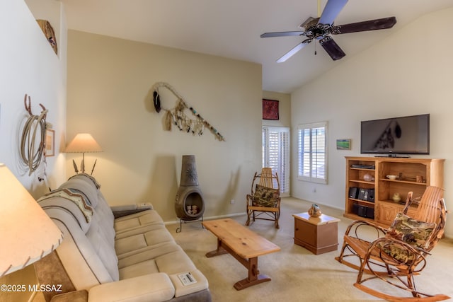 carpeted living room featuring vaulted ceiling and ceiling fan