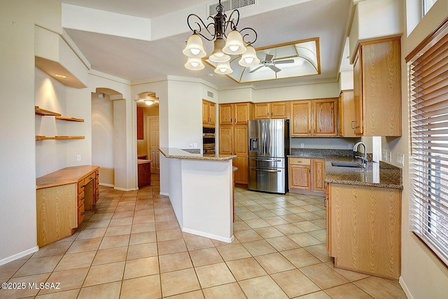 14686 N Lost Arrow Dr, Oro Valley, AZ 85755 - kitchen featuring sink, light tile patterned floors, appliances with stainless steel finishes, pendant lighting, and ceiling fan with notable chandelier