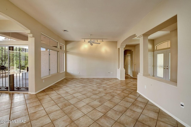 14686 N Lost Arrow Dr, Oro Valley, AZ 85755 - spare room with light tile patterned flooring, ceiling fan, track lighting, and ornate columns