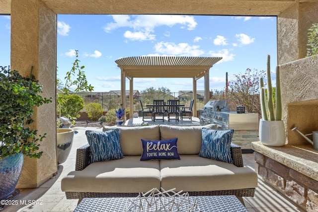 view of patio / terrace with outdoor dining area, exterior kitchen, an outdoor living space, and fence