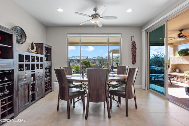 dining room featuring baseboards, recessed lighting, ceiling fan, and light tile patterned floors