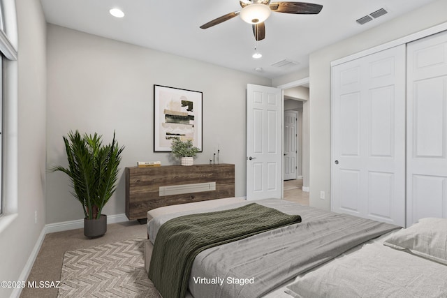 bedroom with recessed lighting, visible vents, baseboards, light carpet, and a closet