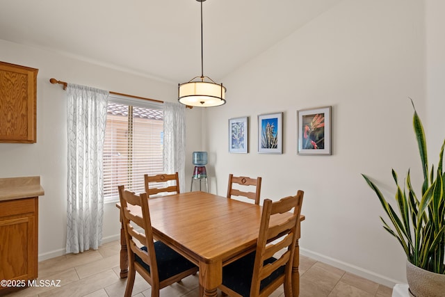 dining space with vaulted ceiling