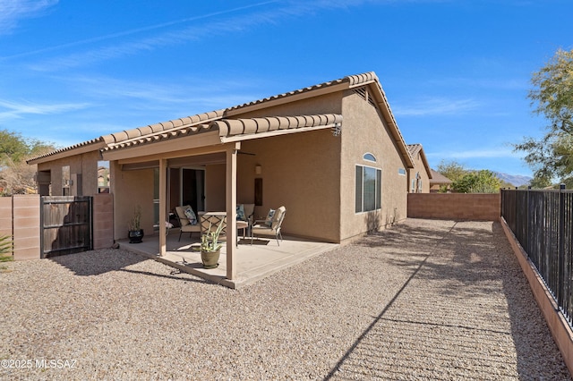 rear view of property featuring a patio