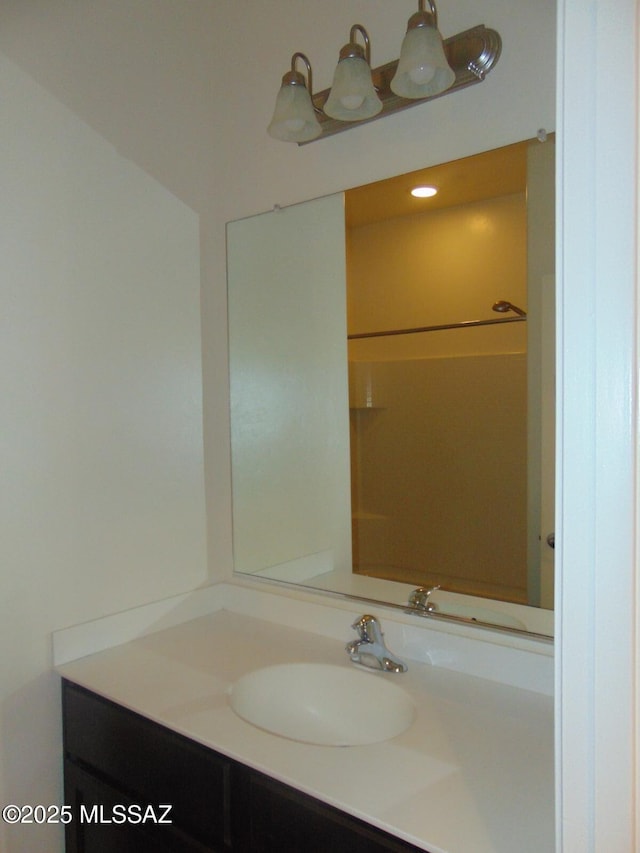 full bathroom with vanity and walk in shower