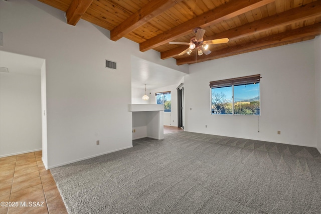 unfurnished living room featuring tile patterned flooring, ceiling fan, wooden ceiling, and beamed ceiling