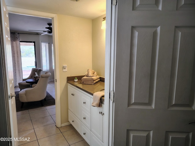 bathroom featuring tile patterned flooring, ceiling fan, and vanity