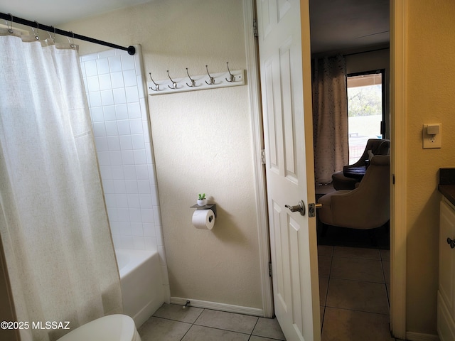 full bathroom featuring toilet, tile patterned floors, vanity, baseboards, and shower / tub combo with curtain