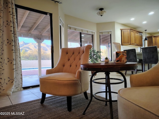 living area with light tile patterned floors and recessed lighting