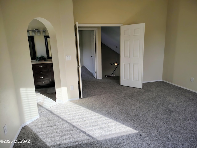 unfurnished bedroom featuring a closet, carpet flooring, and baseboards