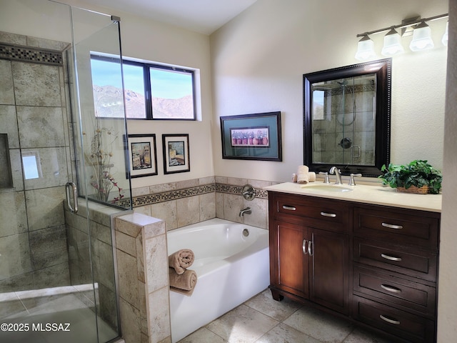 bathroom featuring a shower stall, vanity, and a bath