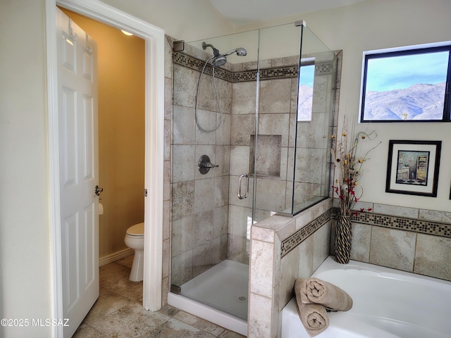 full bathroom featuring a bath, a stall shower, tile patterned flooring, and toilet