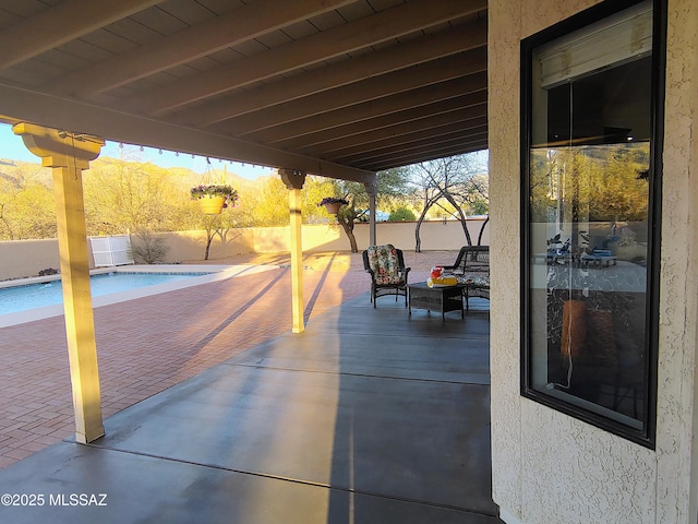 view of patio with a fenced in pool and a fenced backyard