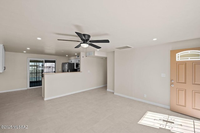 unfurnished living room with ceiling fan