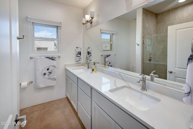 bathroom with vanity and a shower with door