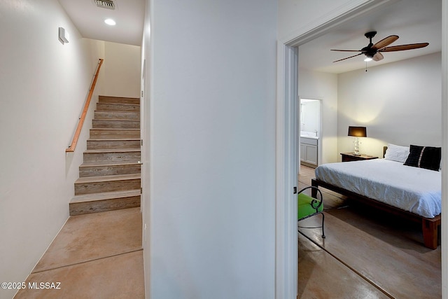 interior space with ceiling fan and concrete floors